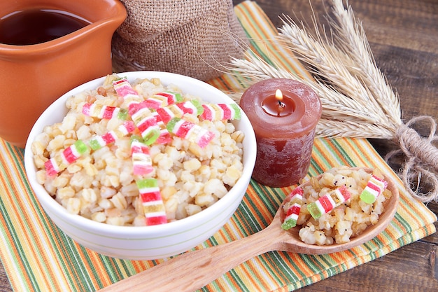 Bowl with kutia -  traditional Christmas sweet meal in Ukraine, Belarus and Poland, on wooden background