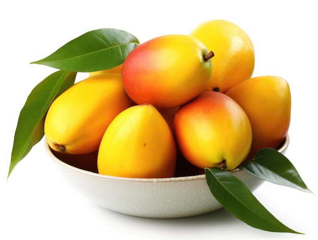 Bowl with mangoes and green leaves on a white background