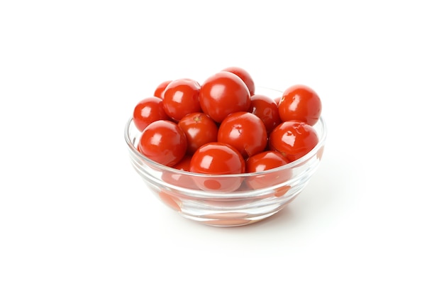 Bowl with pickled tomatoes isolated on white background