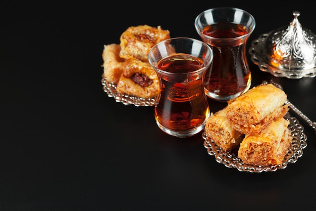 Bowl with pieces of turkish delight lokum and black tea