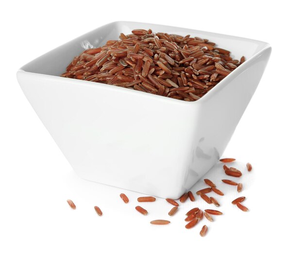 Bowl with red Cargo rice on white background