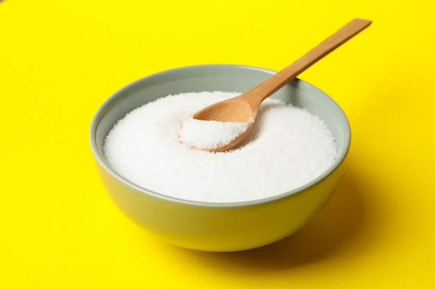 Bowl with salt and spoon isolated