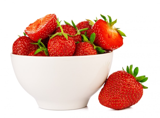 Bowl with strawberries isolated on white