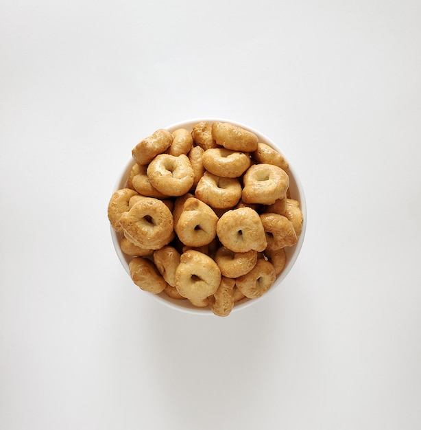 Bowl with taralli isolated on white background, top view, copy space, flat lay.