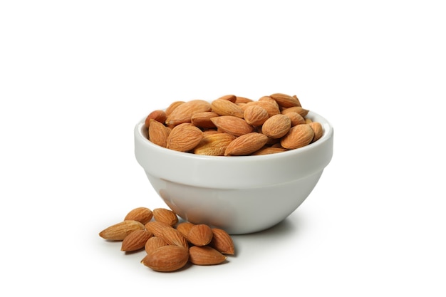 Bowl with tasty almond isolated on white