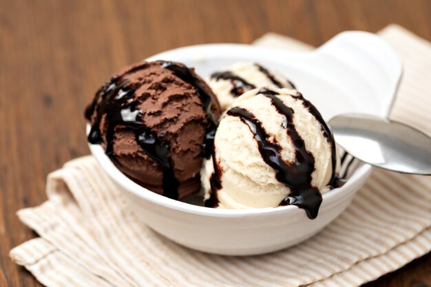 Photo bowl with tasty ice cream on table