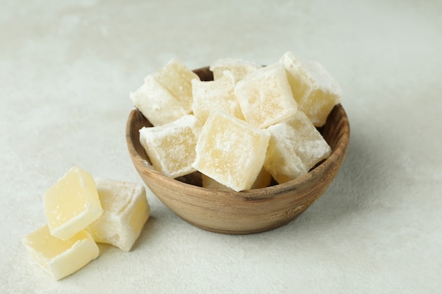 Bowl with turkish delight cubes on white