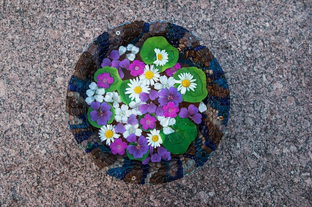 Bowl with water and flowers