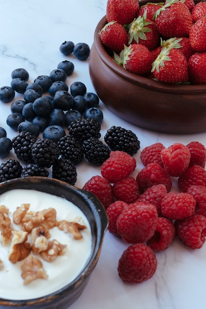 Bowl with yoghurt, berries and nuts