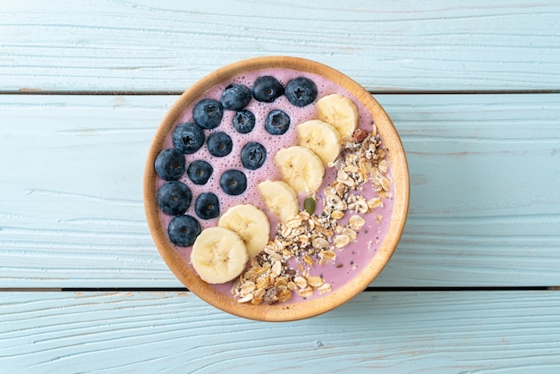 Bowl with yoghurt, blueberries, banana and granola