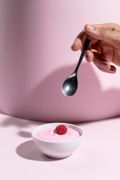 Bowl with yougurt with raspberry