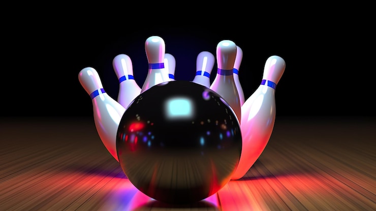 Foto bowlingbal raakt alle skittles neonlicht