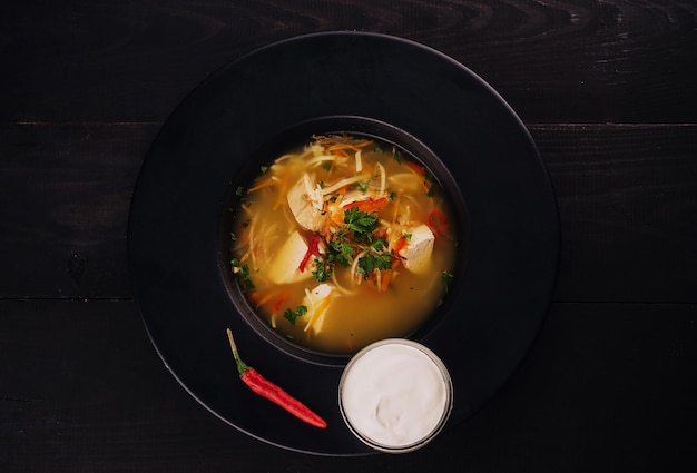 Bowls of Asian soup noodles and vegetables