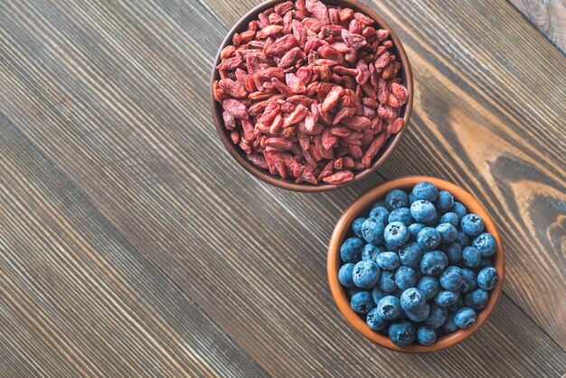 Bowls of blueberries and goji berries