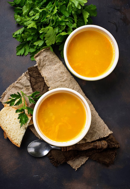 Bowls of hot vegetarian red lentil soup