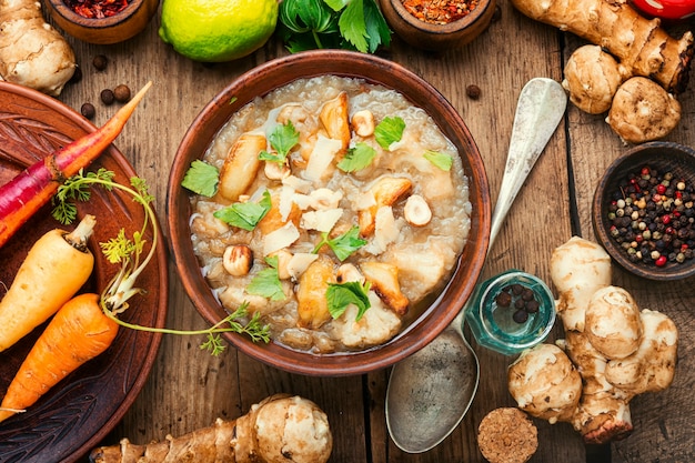 Bowls with delicious artichoke soup