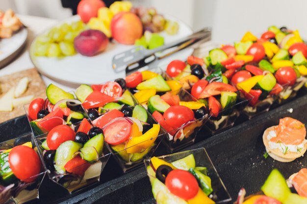 Bowls with salad on table