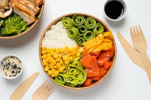 Bowls with tasty and nutritious food top view