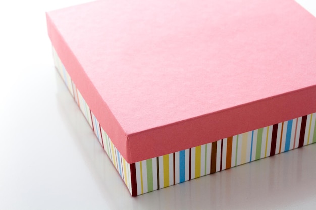 Box of assorted gourmet truffles on a white background.