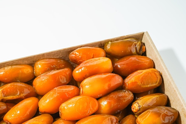 A box of dates is shown with a white background.