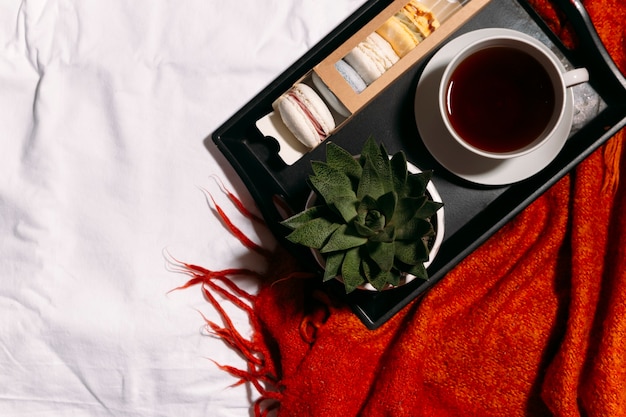 box of macaroons and cup