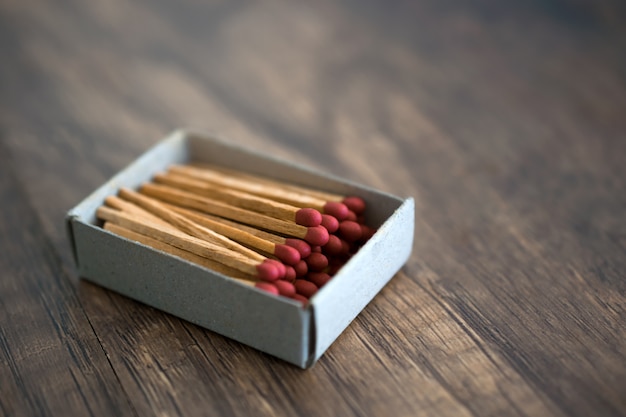 Photo box of matches on wood table baclground