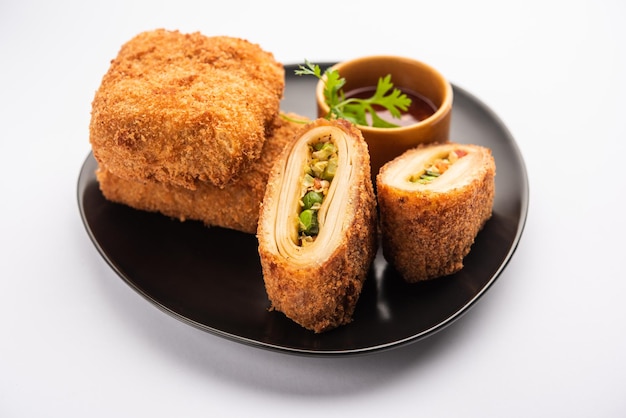 Box patties, delicious deep fried south iasian pastry snack\
filled with something savory and coated with bread crumb