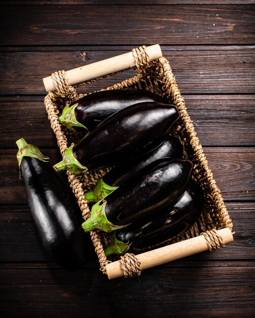 Box on a table with ripe eggplant