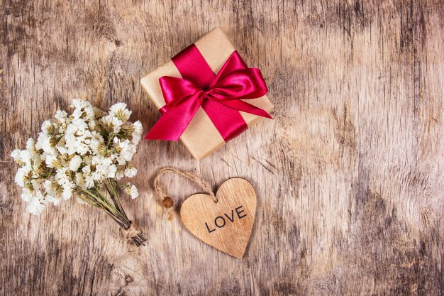 box with bow on wooden background. Festive concept.