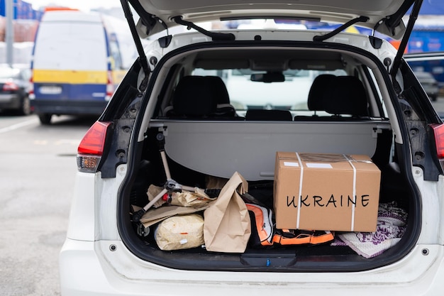 Box with donation clothes for ukrainian refugees suffering from war Charity and Helping poor and needy people Stay with Ukraine