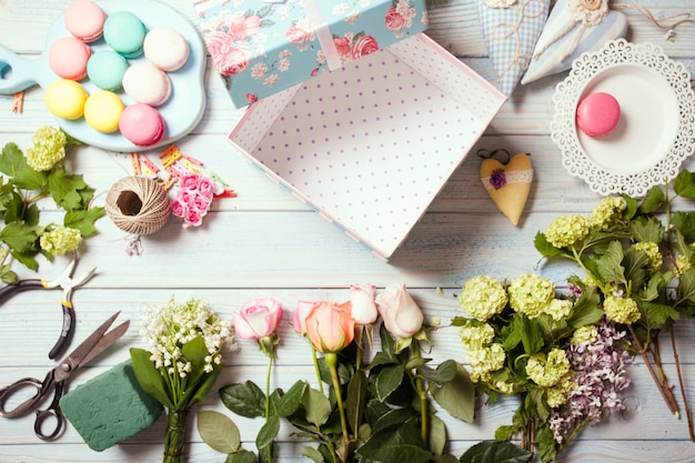 Box with flowers and macaroons