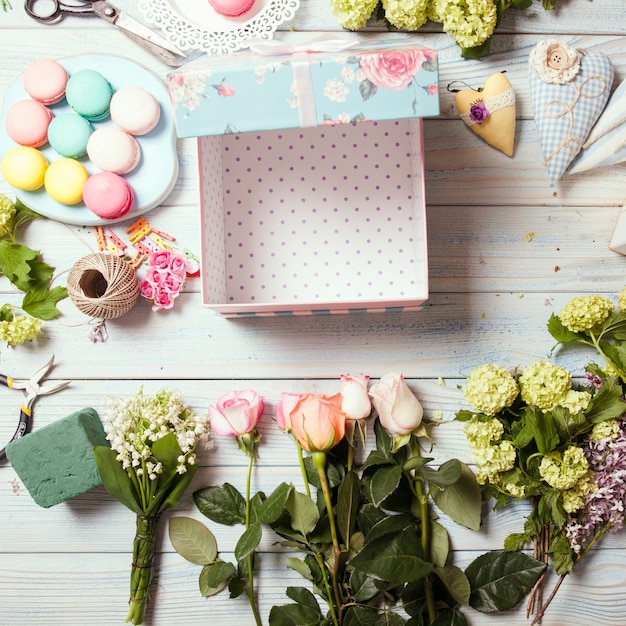 Box with flowers and macaroons