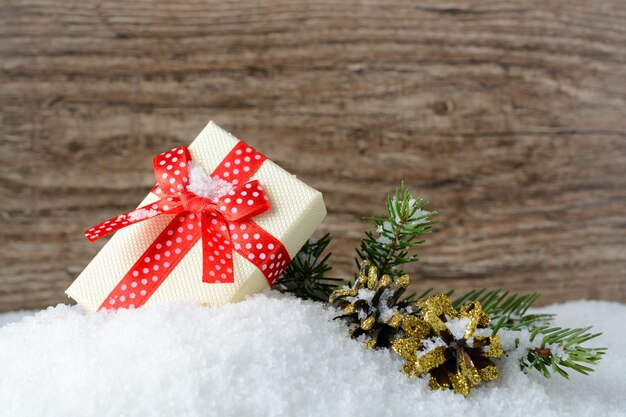 Box with a gift and New Year decorations