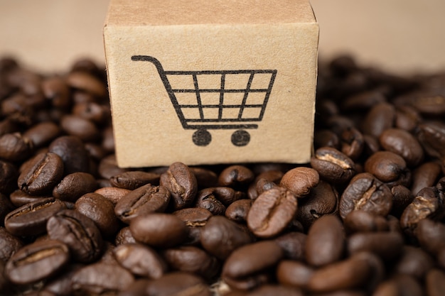 Box with shopping cart logo symbol on coffee beans