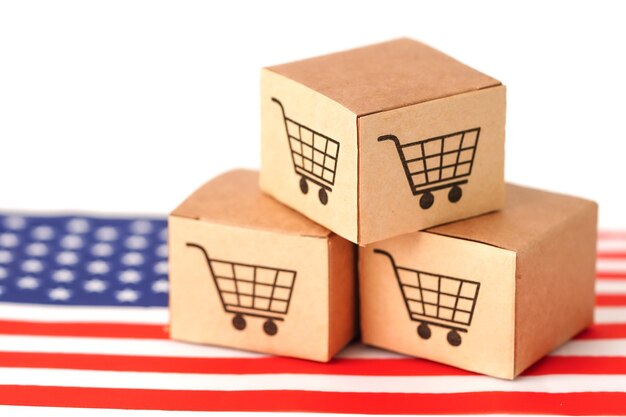 Box with shopping cart logo and USA America flag Import Export Shopping online or eCommerce finance delivery service store product shipping trade supplier concept