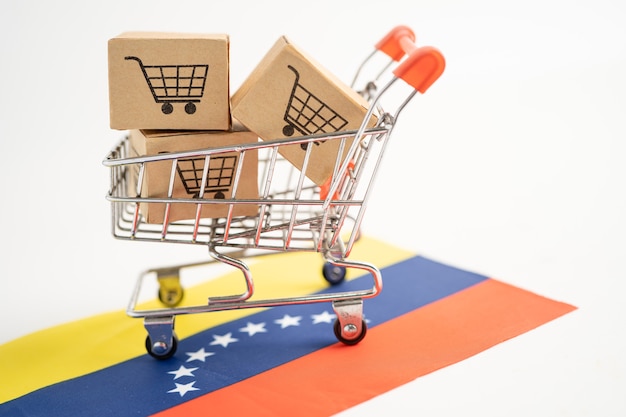 ショッピングカートのロゴとベネズエラの旗が付いたボックスインポートエクスポート