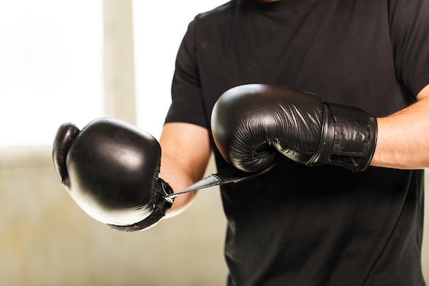 Boxer dressed in tshirt manages with