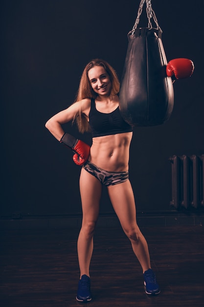 Boxer woman closed her fists in a gesture of readiness for battle