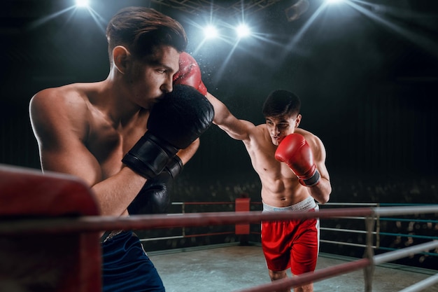 Boxers man fighting in ring