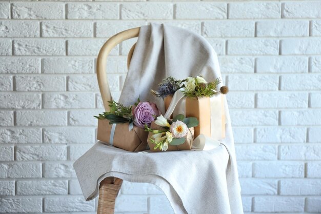 Boxes decorated with flowers on chair