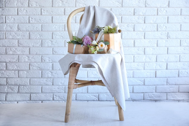 Boxes decorated with flowers on chair