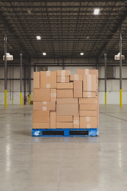 Boxes organized on pallet in the middle of the warehouse