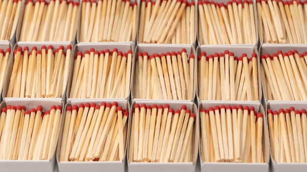 Boxes with new matchsticks as a background Top view