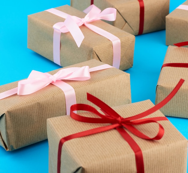 Boxes wrapped in brown paper and tied with a silk ribbon, gifts