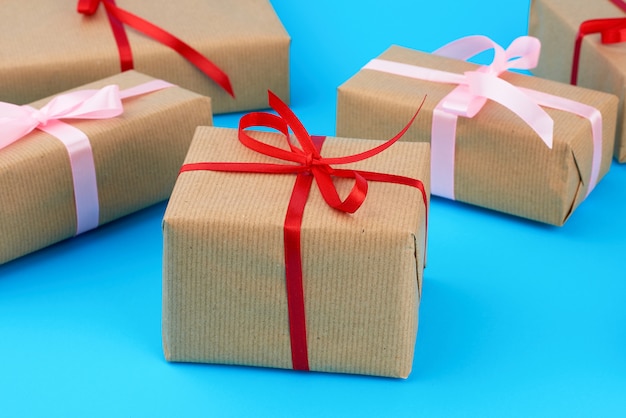 Boxes wrapped in brown paper and tied with a silk ribbon