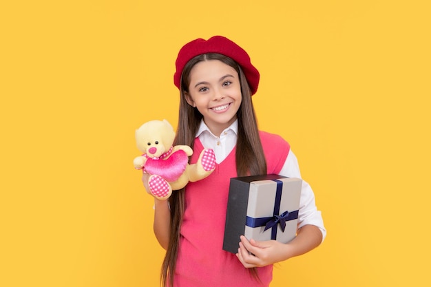 Boxing day kid in beret with toy smiling child has birthday teenage beauty go shopping
