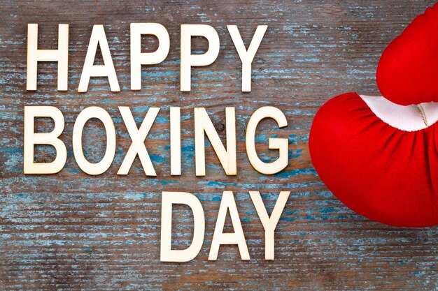 Photo boxing day sale concept on wooden background.