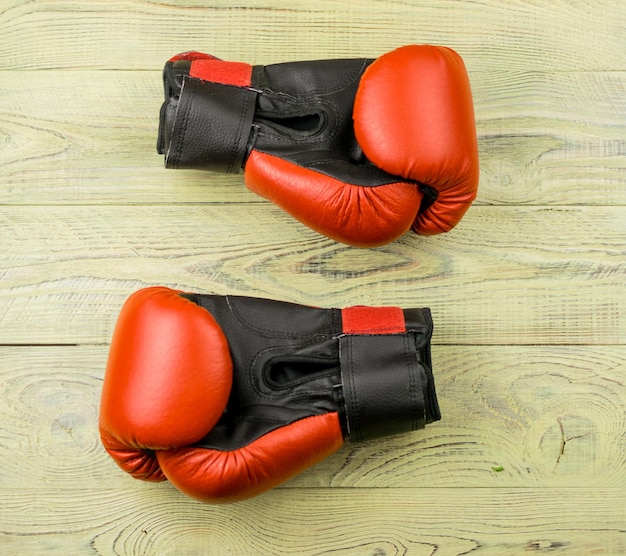 Boxing gloves on a wooden background