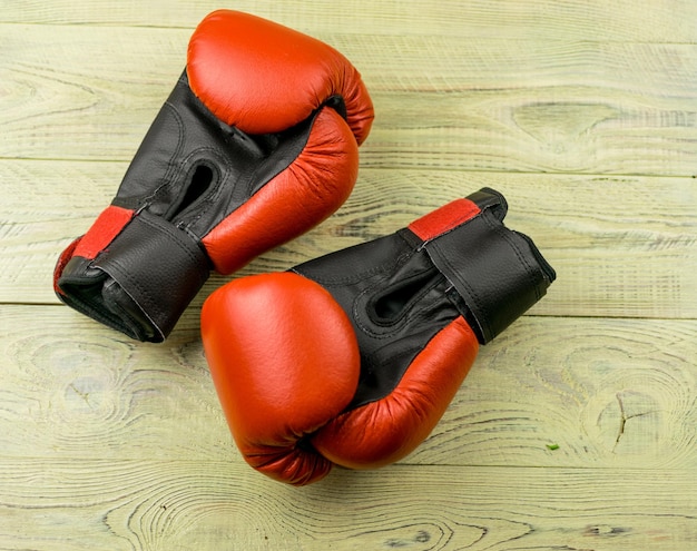 Boxing gloves on a wooden background