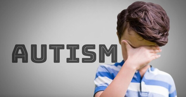 Boy against grey background with autism text